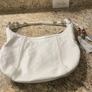 Gucci white stamped leather purse. In very good condition.